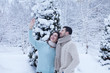 © maryadam - happy loving couple walking in snowy winter forest, spending christmas vacation together. Outdoor seasonal activities. Lifestyle capture. Young Couple In Alpine Snow Scene