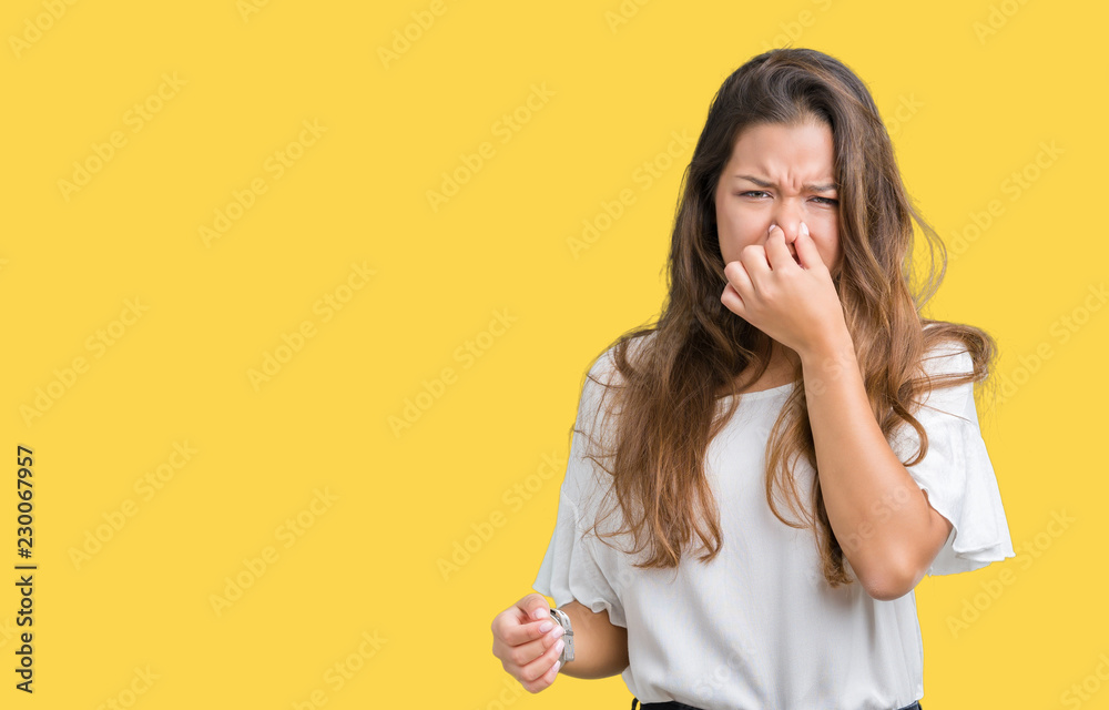 Young beautiful brunette business woman over isolated background ...