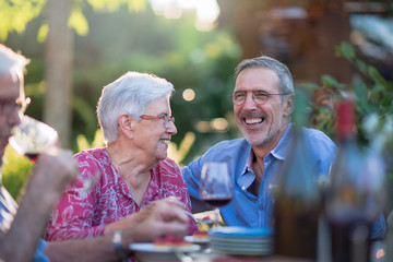 during a family bbq a son toasts with his mother