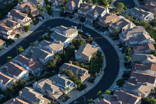 Aerial View Of Curving Street With Dense Modern Housing In Los Angeles, California.