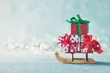 Gorgeous Christmas Presents On Santas Sleigh. Miniature Christmas Winter Wonderland. Xmas Greeting Card With Copy Space.