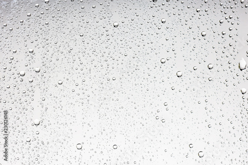 Fotomural white isolated background water drops on the glass / wet window glass with splas