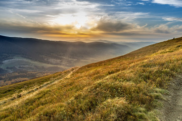 Wall Mural - Sunset in the autumn in the mountains. Bieszczady National Park - Caryńska meadow - Poland.