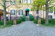Courtyard with trees and lion statues in an Italian palazzo 