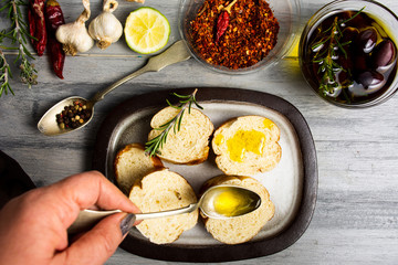 Woman making bruschetta first person view