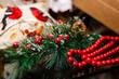 © Angelov - Christmas decor, red beads and branch of fir-tree