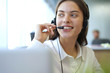 © ty - Customer support operator working in a call center office.