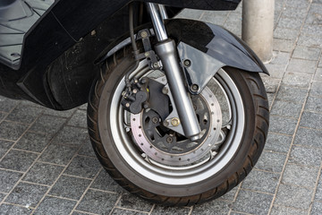 the front wheel of the moped. disc brakes