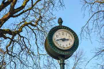 old clock on a background of blue sky