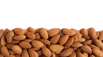 Poster - heap of almonds isolated on white background