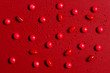 Pattern of red candy on the red background
