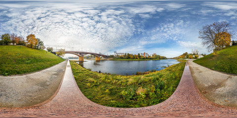 Wall Mural - full seamless spherical panorama 360 degrees angle view on bank of wide river in front of bridge in city center. 360 panorama in equirectangular projection, ready VR AR virtual reality content