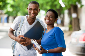 portrait of young happy students outdoors