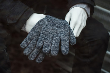 Wall Mural - closeup of wool gloves on mannequin in fashion store showroom for men