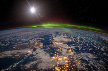 Ireland, United Kingdom and Scandinavia on a moonlit night under an amazing aurora. The elements of this image furnished by NASA.