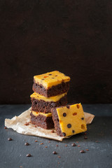 Canvas Print - Brownies with cheese cake made from pumpkin, decorated with pease of chocolate and lingonberry 