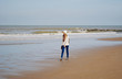 © Olesia - Girl walking along the sea shore