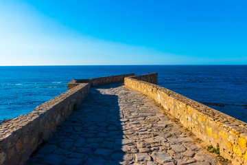 Wall Mural - Ancient city wall of white medina of the town Asilah at ocean coast, Morocco in Africa