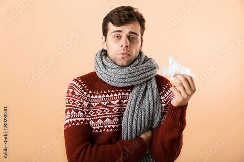 Fotomural Portrait of a sick young man dressed in sweater
