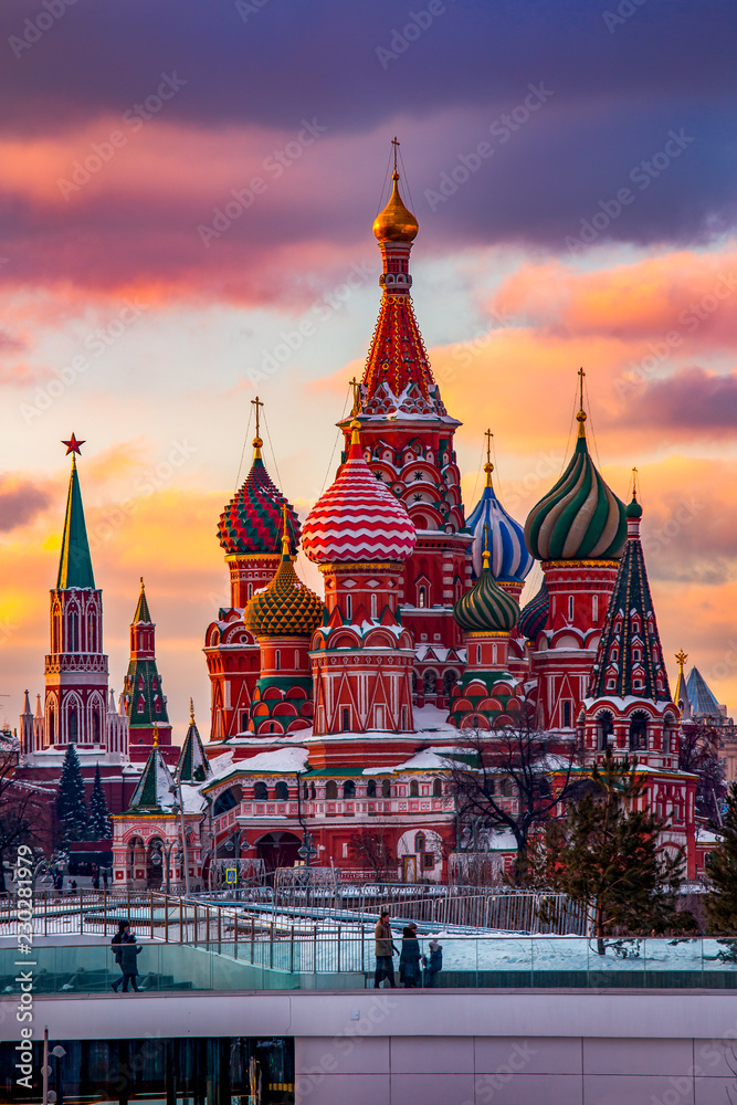 Moscow, Capital city of Russia. Beautiful view of Saint Basil`s Cathedral during sunset time. Clouds are in purple and orange colors. - obrazy, fototapety, plakaty 