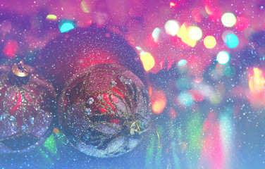 Wall Mural - christmas ball close-up on the background of lanterns blurred by a purple and blue background and ru