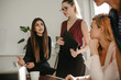 © Jacob Lund - Businesswomen in discussion at office