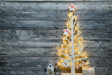 Wall Mural - christmas wooden tree natural decoration ornament and copyspace on old wood board