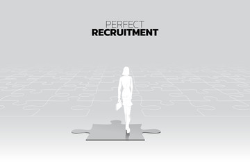 Poster - Silhouette of businesswomen with briefcase stand on match jigsaw piece. Concept of perfect job.Team recruitment.Human Resource.put the right man on the right job.