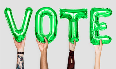 Wall Mural - Green alphabet balloons forming the word vote