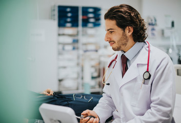 Wall Mural - Doctor checking a patients blood pressure