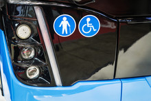 Front Lights Bus With Symbols Stickers Transport For The Disabled And The Elderly. Modern Lead And Halogen Lighting
