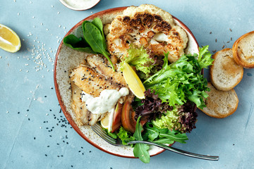 Wall Mural - top view clean balanced healthy food Healthy lunch Fried fish fillet vegetables