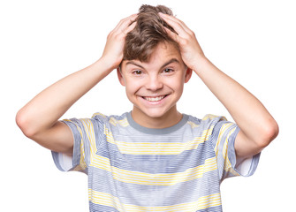 Close up emotional portrait of caucasian teen boy. Surprised teenager looking at camera. Handsome happy child, isolated on white background.