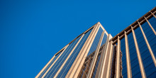 Glass building against blue sky in Salt Lake City