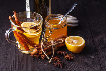 winter hot drink mulled wine with cinnamon and lemon