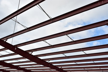 Wall Mural - Steel roof beams of new commercial building under construction.