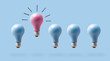 One outstanding idea concept with light bulbs on a blue background