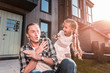 © Viacheslav Yakobchuk - Playing tricks. Funny little beautiful daughter playing some tricks with her handsome young father