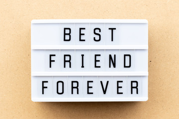 Poster - Light box with word best friend forever on wood background