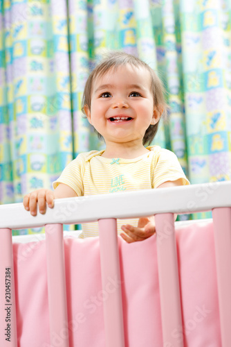 1 Year Old Baby Girl In A Cradle Buy This Stock Photo And