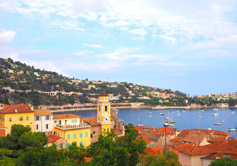 Wall Mural - View of luxury resort Villefranche-sur-Mer, old city and bay on French Riviera at Mediterranean Sea. Cote d'Azur. France.