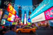 Happy New Year Message Hanging In Front Of The Bright Lights Of Times Square, New York City, USA