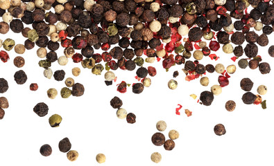 Wall Mural - Mix of different peppers isolated on white background (black, red, green and white peppercorns)