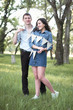 © soleg - young couple posing with flags in the forest, summer nature, romantic feelings