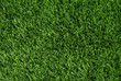 Artificial green grass texture background top view.