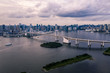 Aerial drone photo - Rainbow Bridge and the skyline of Tokyo at sunset.  Capital city of Japan.  