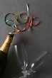 © Steve Cukrov - Champagne bottle with colorful ribbons and two glasse