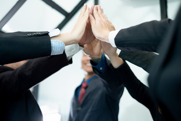 businesspeople raise hand high fives together.businesspeople celebrating in office success deal business, business concept, business success concept