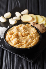 Poster - Ginger and Garlic paste or Adrak Lahsun puree closeup on table. vertical