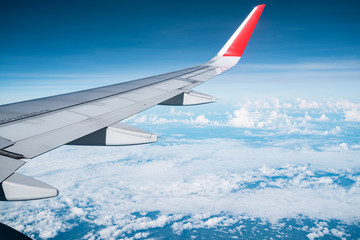 Wall Mural - Beautiful view from airplane window and blue sky on nice sunny day, This time in altitude during flight.